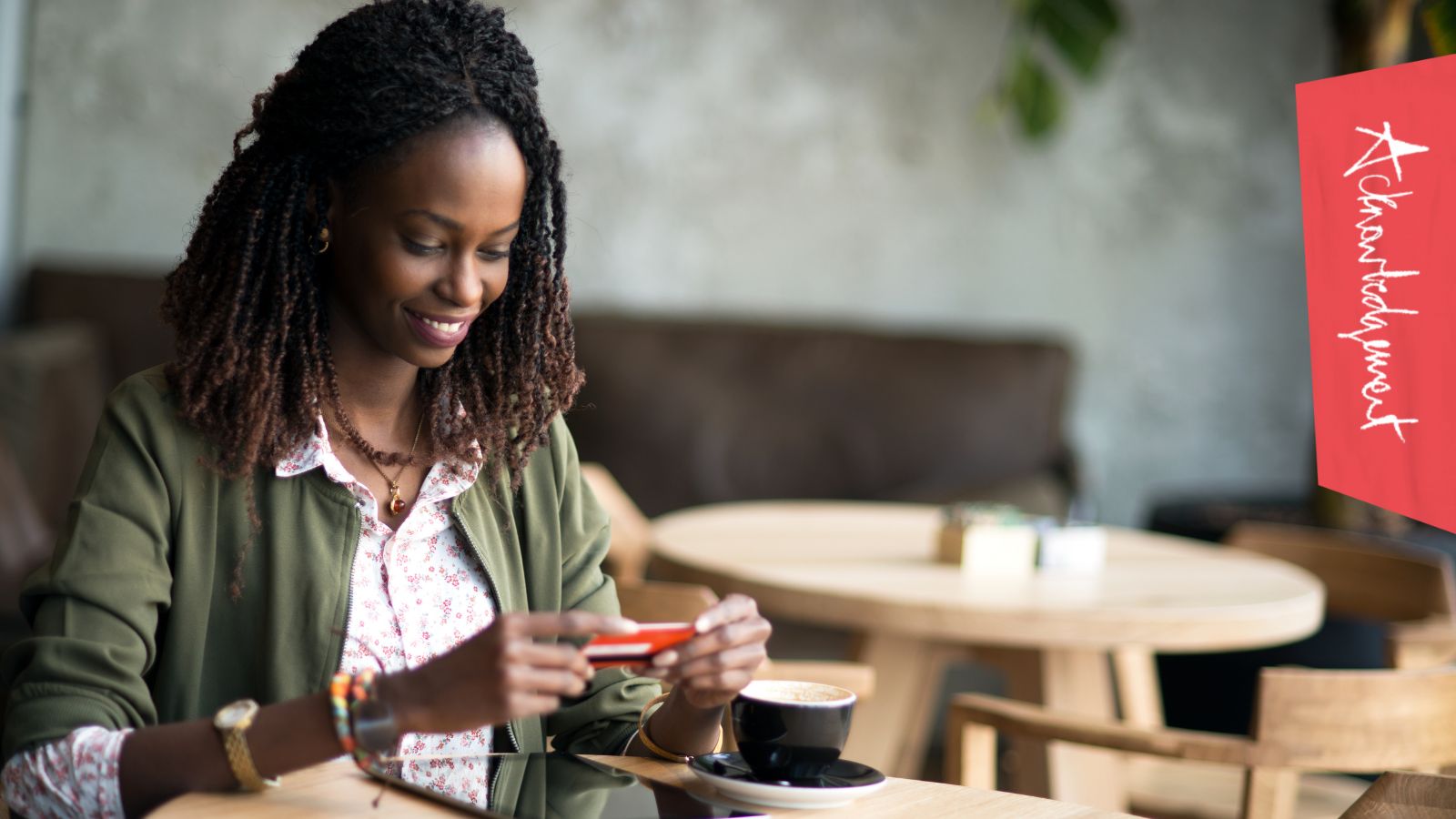 A lady looking at her bank card